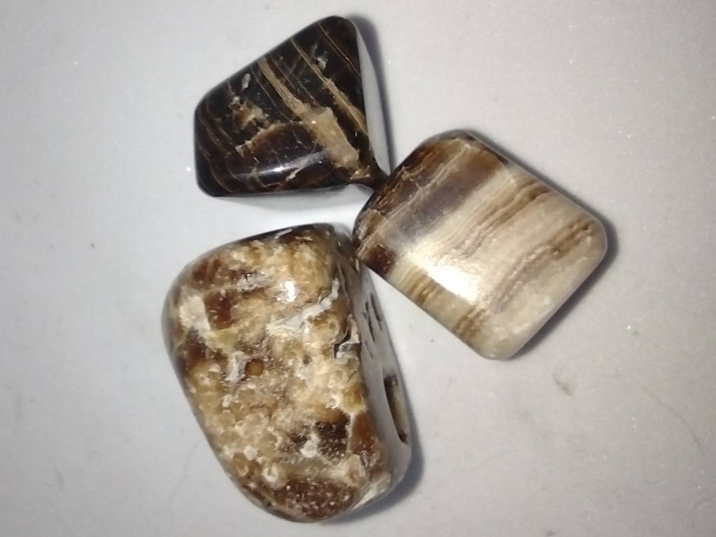 Chocolade Calciet trommelstenen en handstenen