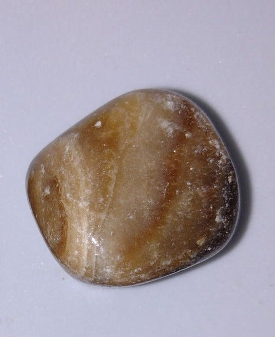 Chocolade Calciet trommelstenen en handstenen